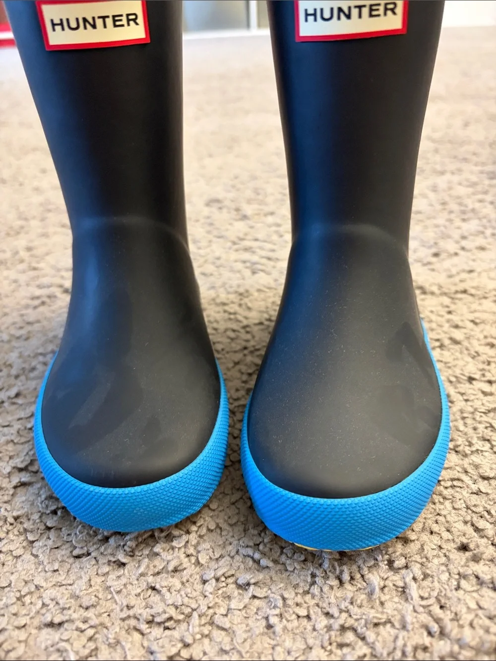 Hunter Kids Black Rain Boots with Bright Blue Soles